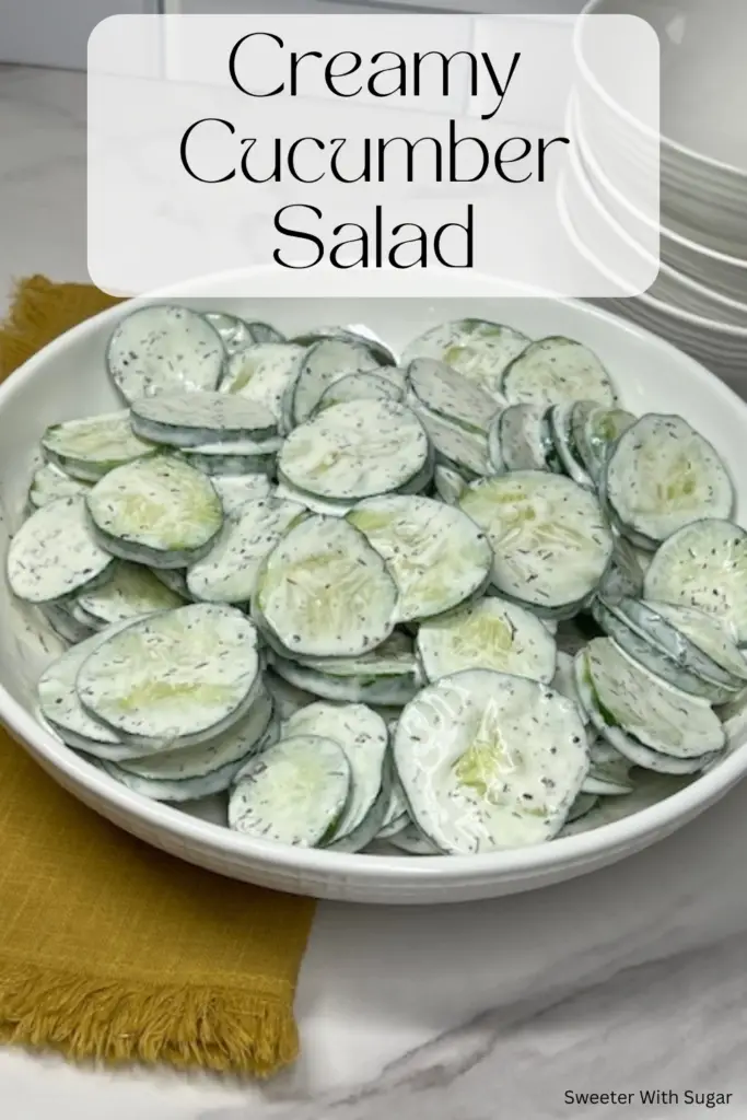 This Creamy Cucumber Salad recipe is quick to make and delicious! Crisp cucumbers are tossed in a tangy and creamy dressing made with sour cream, mayonnaise, dill, and a hint of lemon. Perfect as a light side dish for summer barbecues, picnics, or everyday meals, this salad is quick to prepare and bursting with fresh flavor. #CreamyCucumberSalad #SummerRecipes #FreshSalads #EasySideDishes #HealthyEating #BBQSide #PicnicFood