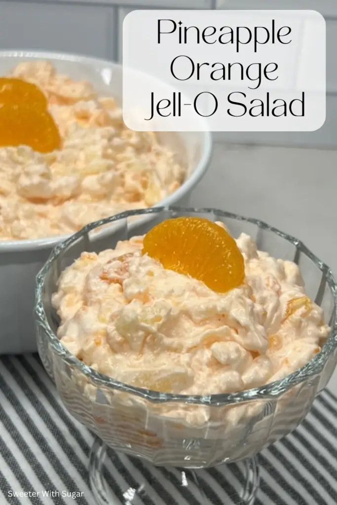 This Pineapple Orange Jell-O Salad recipe is not only delicious it is pretty! You will love this salad as part of any meal. A nostalgic favorite, this salad combines juicy pineapple, orange Jell-O, mandarin oranges, pudding and creamy whipped topping for a refreshing and sweet fruit salad, side dish or even dessert. Perfect for potlucks, family gatherings, or holiday meals, this easy-to-make salad is a crowd-pleaser that adds a burst of color and flavor to any occasion. #JelloSalad #PineappleOrangeSalad #PotluckRecipes #RetroRecipes #EasyDesserts #FamilyFavorites #HolidayRecipes