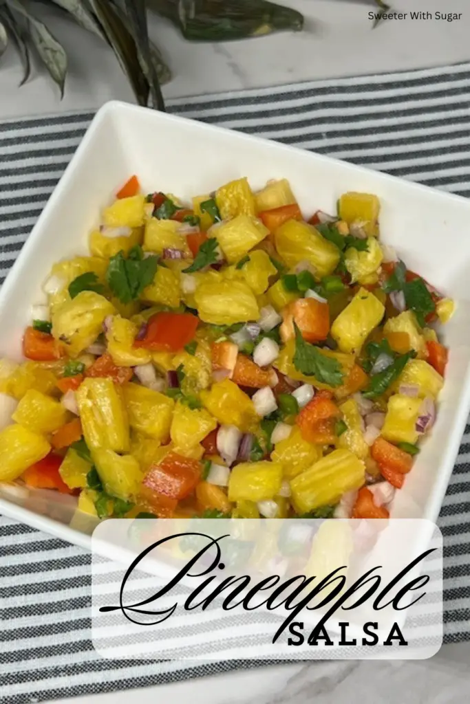 Pineapple Salsa is a simple flavorful recipe! Juicy pineapple is combined with red onion, red bell pepper, cilantro, and jalapeños for a perfect balance of sweet, tangy, and spicy flavors. Ideal for topping grilled fish, chicken, tacos, or served as a dip with chips. This tropical salsa is a refreshing addition to summer meals and gatherings.  #PineappleSalsa #FreshSalsa #TropicalRecipes #SweetAndSpicy #SummerDishes #HealthySnacks #GrilledToppings