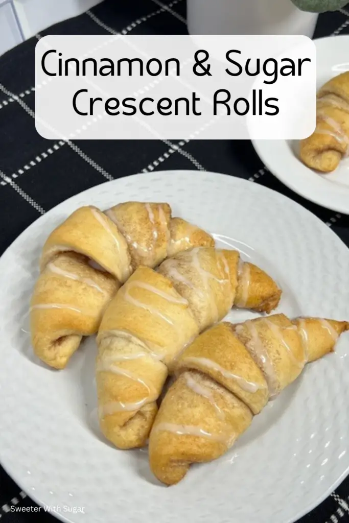 A plate of golden brown cinnamon sugar crescent rolls, filled with a buttery cinnamon and sugar filling and with a drizzle of vanilla glaze on top.

#CinnamonSugarCrescentRolls #EasyBaking #CrescentRollRecipes #MiniCinnamonRolls #SweetBreakfast #HomemadeTreats #SimpleDesserts